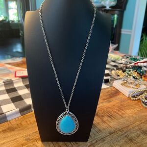 Turquoise pendant necklace and orange beaded necklace